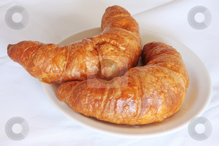 To use this stock image in your creative project, please select the size you need over to the right and click the "Add to Cart" button.
Your downloaded image will come with the Cutcaster watermark removed so don’t worry about the watermark you see on this page. Fresh croissants stock photo, Freshly baked croissant french pastry bread on white plate by Kheng Guan Toh