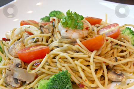 To use this stock image in your creative project, please select the size you need over to the right and click the "Add to Cart" button.
Your downloaded image will come with the Cutcaster watermark removed so don’t worry about the watermark you see on this page. Seafood pasta stock photo, Seafood pasta with prawns and mushrooms on white plate by Kheng Guan Toh