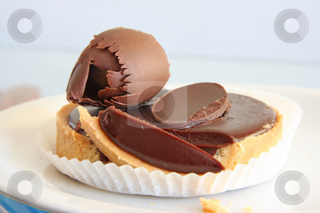 To use this stock image in your creative project, please select the size you need over to the right and click the "Add to Cart" button.
Your downloaded image will come with the Cutcaster watermark removed so don’t worry about the watermark you see on this page. Dark chocolate torte stock photo, Dark chocolate torte sweet pastry dessert tart with ganache by Kheng Guan Toh