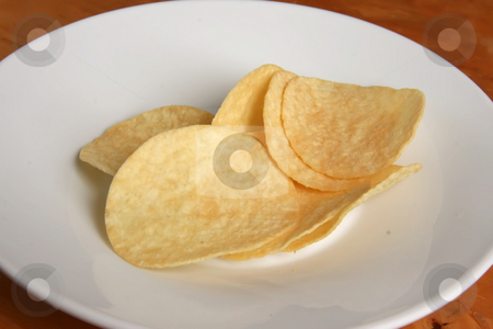 To use this stock image in your creative project, please select the size you need over to the right and click the "Add to Cart" button.
Your downloaded image will come with the Cutcaster watermark removed so don’t worry about the watermark you see on this page. Potato chips stock photo, Fried potato chip snack food in white plate by Kheng Guan Toh