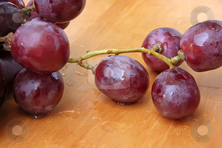 To use this stock image in your creative project, please select the size you need over to the right and click the "Add to Cart" button.
Your downloaded image will come with the Cutcaster watermark removed so don’t worry about the watermark you see on this page. Red grapes stock photo, Bunch of red globe grapes fresh fruit by Kheng Guan Toh
