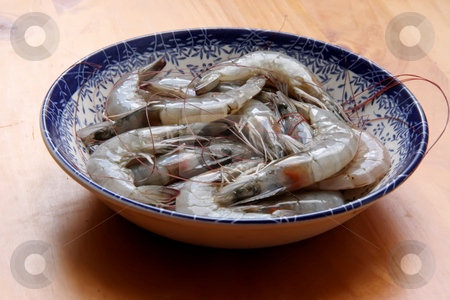 To use this stock image in your creative project, please select the size you need over to the right and click the "Add to Cart" button.
Your downloaded image will come with the Cutcaster watermark removed so don’t worry about the watermark you see on this page. Raw prawns stock photo, Whole fresh raw prawns in shell unpeeled by Kheng Guan Toh