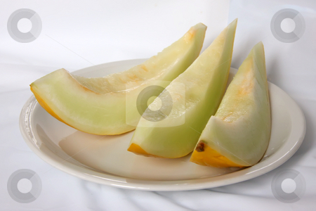To use this stock image in your creative project, please select the size you need over to the right and click the "Add to Cart" button.
Your downloaded image will come with the Cutcaster watermark removed so don’t worry about the watermark you see on this page. Yellow melon stock photo, Yellow melon cut in slices fresh fruit by Kheng Guan Toh