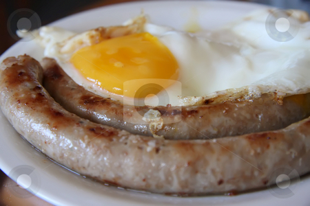 To use this stock image in your creative project, please select the size you need over to the right and click the "Add to Cart" button.
Your downloaded image will come with the Cutcaster watermark removed so don’t worry about the watermark you see on this page. Sausage and eggs stock photo, Breakfast sausages and fried eggs on white plate by Kheng Guan Toh