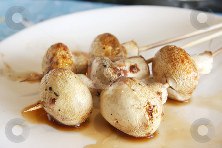 To use this stock image in your creative project, please select the size you need over to the right and click the "Add to Cart" button.
Your downloaded image will come with the Cutcaster watermark removed so don’t worry about the watermark you see on this page. Grilled mushrooms stock photo, Grilled button mushrooms skewerd on wooden sticks by Kheng Guan Toh