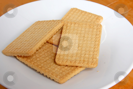 To use this stock image in your creative project, please select the size you need over to the right and click the "Add to Cart" button.
Your downloaded image will come with the Cutcaster watermark removed so don’t worry about the watermark you see on this page. Plain cookies stock photo, Plain cookie biscuits arranged on white plate by Kheng Guan Toh