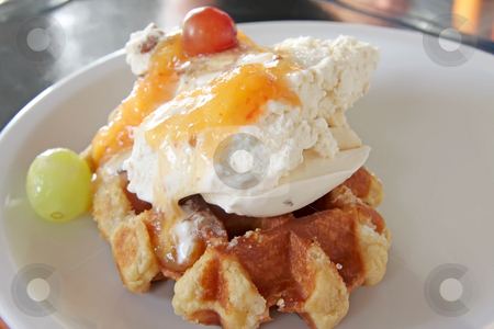 To use this stock image in your creative project, please select the size you need over to the right and click the "Add to Cart" button.
Your downloaded image will come with the Cutcaster watermark removed so don’t worry about the watermark you see on this page. Ice cream waffle stock photo, Ice cream on waffle with fruits and sauce by Kheng Guan Toh