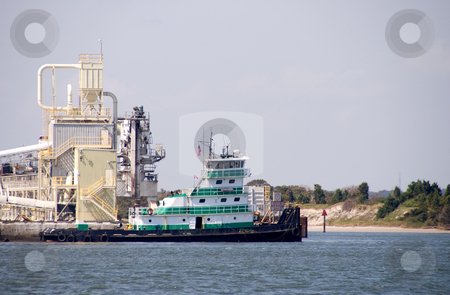 To use this stock image in your creative project, please select the size you need over to the right and click the "Add to Cart" button.
Your downloaded image will come with the Cutcaster watermark removed so don’t worry about the watermark you see on this page. Tugboat stock photo, A tugboat docked at a seaside dock. by Robert Byron