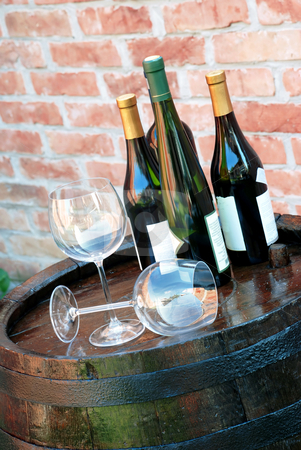 To use this stock image in your creative project, please select the size you need over to the right and click the "Add to Cart" button.
Your downloaded image will come with the Cutcaster watermark removed so don’t worry about the watermark you see on this page. Wine over wood barrel stock photo, Glasses and bottles of wine lying over wooden barrel by Julija Sapic