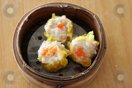 To use this stock image in your creative project, please select the size you need over to the right and click the "Add to Cart" button.
Your downloaded image will come with the Cutcaster watermark removed so don’t worry about the watermark you see on this page. Steamed dimsum stock photo, Chinese steamed dimsum in bamboo containers traditional cuisine by Kheng Guan Toh