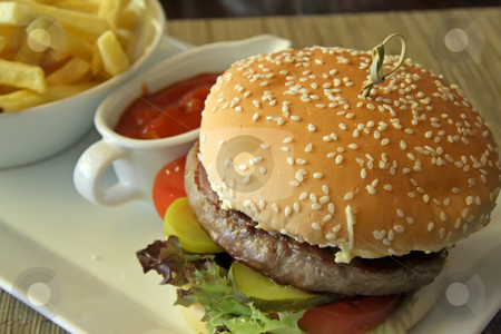 To use this stock image in your creative project, please select the size you need over to the right and click the "Add to Cart" button.
Your downloaded image will come with the Cutcaster watermark removed so don’t worry about the watermark you see on this page. Fancy cheeseburger stock photo, Fancy cheeseburger with french fries served in restaurant by Kheng Guan Toh
