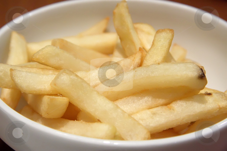 To use this stock image in your creative project, please select the size you need over to the right and click the "Add to Cart" button.
Your downloaded image will come with the Cutcaster watermark removed so don’t worry about the watermark you see on this page. French fries stock photo, Bowl of french fried potatoes straight cut by Kheng Guan Toh