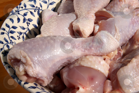 To use this stock image in your creative project, please select the size you need over to the right and click the "Add to Cart" button.
Your downloaded image will come with the Cutcaster watermark removed so don’t worry about the watermark you see on this page. Raw chicken drumsticks stock photo, Raw chicken drumstick parts in pile in bowl by Kheng Guan Toh