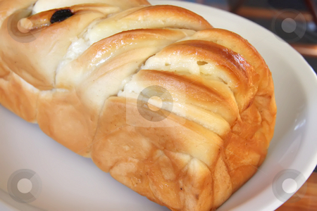 To use this stock image in your creative project, please select the size you need over to the right and click the "Add to Cart" button.
Your downloaded image will come with the Cutcaster watermark removed so don’t worry about the watermark you see on this page. Sweet german bread stock photo, Sweet german milk bread pastry whole loaf by Kheng Guan Toh
