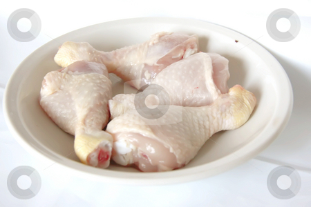 To use this stock image in your creative project, please select the size you need over to the right and click the "Add to Cart" button.
Your downloaded image will come with the Cutcaster watermark removed so don’t worry about the watermark you see on this page. Raw chicken drumsticks stock photo, Raw chicken drumstick parts in pile in bowl by Kheng Guan Toh