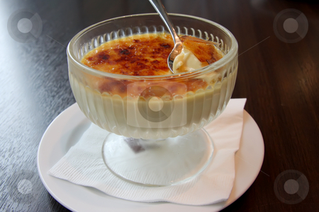 To use this stock image in your creative project, please select the size you need over to the right and click the "Add to Cart" button.
Your downloaded image will come with the Cutcaster watermark removed so don’t worry about the watermark you see on this page. Creme brulee stock photo, Bowl of creme brulee cremy pudding dessert by Kheng Guan Toh