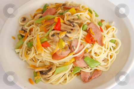 To use this stock image in your creative project, please select the size you need over to the right and click the "Add to Cart" button.
Your downloaded image will come with the Cutcaster watermark removed so don’t worry about the watermark you see on this page. Fried noodles stock photo, Fried noodle pasta fusion cuisine with sausages and vegetables by Kheng Guan Toh