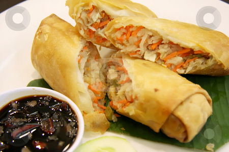 To use this stock image in your creative project, please select the size you need over to the right and click the "Add to Cart" button.
Your downloaded image will come with the Cutcaster watermark removed so don’t worry about the watermark you see on this page. Fried springrolls stock photo, Fried chinese spring rolls traditional vegetable wraps by Kheng Guan Toh