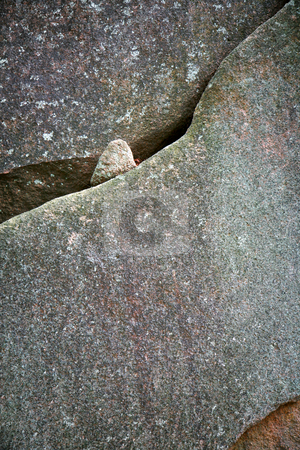 To use this stock image in your creative project, please select the size you need over to the right and click the "Add to Cart" button.
Your downloaded image will come with the Cutcaster watermark removed so don’t worry about the watermark you see on this page. Diagonal lines in the stone stock photo, A small stone showing thru the crevase in the granite by Mitch Aunger