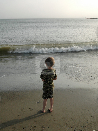 To use this stock image in your creative project, please select the size you need over to the right and click the "Add to Cart" button.
Your downloaded image will come with the Cutcaster watermark removed so don’t worry about the watermark you see on this page. Boy at Beach stock photo, As the day comes to an end, this young boy watches the waves roll in on the pacific ocean. The beach is near Ocean Shores, Wa. by Tim Thompson