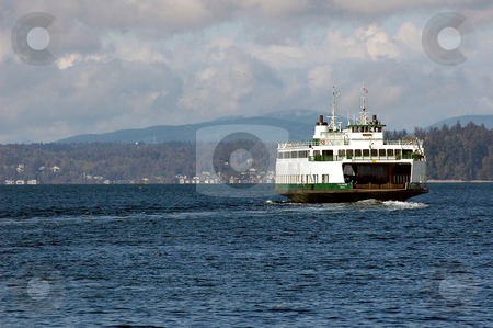 To use this stock image in your creative project, please select the size you need over to the right and click the "Add to Cart" button.
Your downloaded image will come with the Cutcaster watermark removed so don’t worry about the watermark you see on this page. Puget Sound Ferry stock photo, A Washingto state ferry takes off on another run across the southern end of Puget sound. Several communities on the Washington Pennisula rely on the Washington state ferry system to get them where they need to be everyday. by Tim Thompson