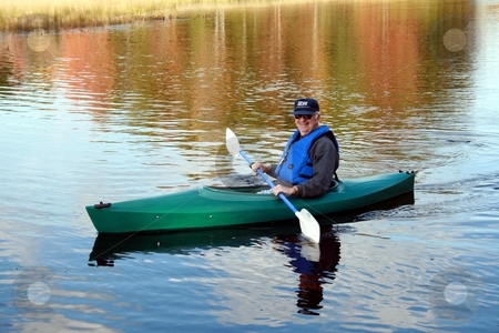 To use this stock image in your creative project, please select the size you need over to the right and click the "Add to Cart" button.
Your downloaded image will come with the Cutcaster watermark removed so don’t worry about the watermark you see on this page. Senior Male, Kayaking stock photo, Senior male kayaking in the Fall by Tom and Beth Pulsipher