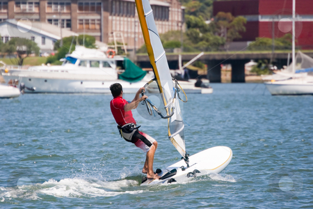 To use this stock image in your creative project, please select the size you need over to the right and click the "Add to Cart" button.
Your downloaded image will come with the Cutcaster watermark removed so don’t worry about the watermark you see on this page. Sailboarder stock photo, Sailboarder on the water by Nicholas Rjabow