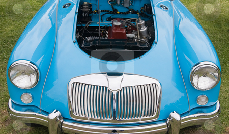 To use this stock image in your creative project, please select the size you need over to the right and click the "Add to Cart" button.
Your downloaded image will come with the Cutcaster watermark removed so don’t worry about the watermark you see on this page. Blue Motor Vehicle stock photo, A blue colored motor vehicle showing the engine bay by Nicholas Rjabow