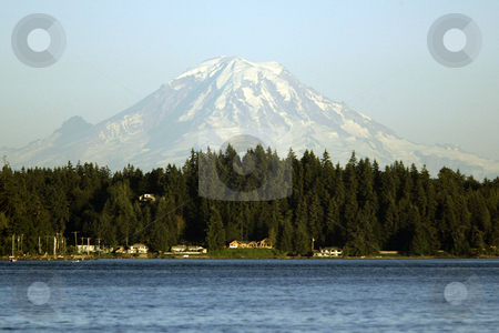 To use this stock image in your creative project, please select the size you need over to the right and click the "Add to Cart" button.
Your downloaded image will come with the Cutcaster watermark removed so don’t worry about the watermark you see on this page. Mt. Rainier stock photo, July 17, 2003 : A snow topped Mt. Rainier could be seen from the Illahee fishing pier. On a sunny day Illahee dock can offer some breath taking pictures in Bremerton, Washington. by Jesse Beals