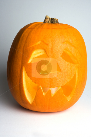 To use this stock image in your creative project, please select the size you need over to the right and click the "Add to Cart" button.
Your downloaded image will come with the Cutcaster watermark removed so don’t worry about the watermark you see on this page. Lighted Halloween Pumpkin stock photo, A lighted halloween 'Jack'o'Lantern' pumpkin against a white background with left-hand side in partial shadow. by Steve Smith