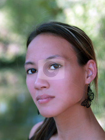 To use this stock image in your creative project, please select the size you need over to the right and click the "Add to Cart" button.
Your downloaded image will come with the Cutcaster watermark removed so don’t worry about the watermark you see on this page. Woman asian american stock photo, Portrait of young asian american woman with leaves in background by Jeff Cleveland