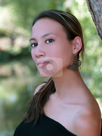 To use this stock image in your creative project, please select the size you need over to the right and click the "Add to Cart" button.
Your downloaded image will come with the Cutcaster watermark removed so don’t worry about the watermark you see on this page. Woman outdoors stock photo, Young asian american woman outdoors portrait green leaves by Jeff Cleveland