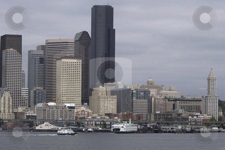 To use this stock image in your creative project, please select the size you need over to the right and click the "Add to Cart" button.
Your downloaded image will come with the Cutcaster watermark removed so don’t worry about the watermark you see on this page. Seattle Washington stock photo, July 22, 2008: The Seattle skyline and Ferry Terminal could be scene from the Walla Walla Washington State Ferry as it left Seattle and heading to Bremerton, Washington. by Jesse Beals