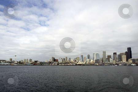 To use this stock image in your creative project, please select the size you need over to the right and click the "Add to Cart" button.
Your downloaded image will come with the Cutcaster watermark removed so don’t worry about the watermark you see on this page. Seattle Washington stock photo, July 22, 2008: The Seattle Space needles and Seattle Waterfront could be scene from the Walla Walla Washington State Ferry as it left Seattle and heading to Bremerton, Washington. by Jesse Beals