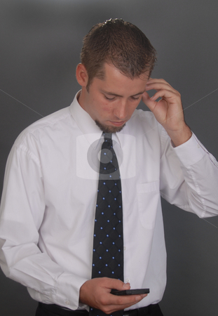 To use this stock image in your creative project, please select the size you need over to the right and click the "Add to Cart" button.
Your downloaded image will come with the Cutcaster watermark removed so don’t worry about the watermark you see on this page. Man at Work stock photo, Young man working by Timothy OLeary