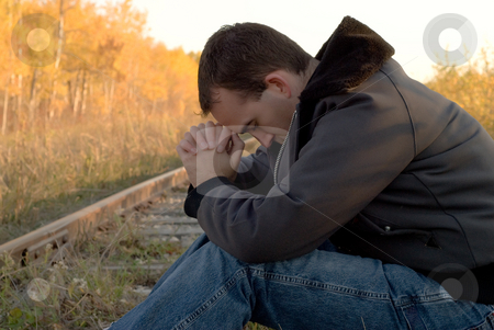 To use this stock image in your creative project, please select the size you need over to the right and click the "Add to Cart" button.
Your downloaded image will come with the Cutcaster watermark removed so don’t worry about the watermark you see on this page. Mood Disorder stock photo, A young man suffering from a mood disorder by Richard Nelson