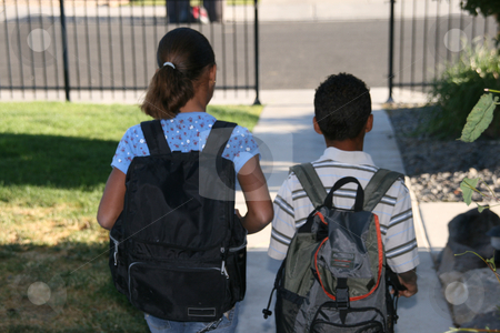 To use this stock image in your creative project, please select the size you need over to the right and click the "Add to Cart" button.
Your downloaded image will come with the Cutcaster watermark removed so don’t worry about the watermark you see on this page. Off to School stock photo, Two african american mixed race children walking off to school by Robin Russell