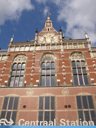 To use this stock image in your creative project, please select the size you need over to the right and click the "Add to Cart" button.
Your downloaded image will come with the Cutcaster watermark removed so don’t worry about the watermark you see on this page. Amsterdam Central Station in Netherlands stock photo, by Ritu Jethani