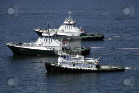 To use this stock image in your creative project, please select the size you need over to the right and click the "Add to Cart" button.
Your downloaded image will come with the Cutcaster watermark removed so don’t worry about the watermark you see on this page. Tug Boats stock photo, July 21, 2003 : Construction was under way on the second Narrows bridge. Tug boats were brought in to help transport the narrows bridge caisson were workers would start to build the base of the bridge in Tacoma, Washington by Jesse Beals