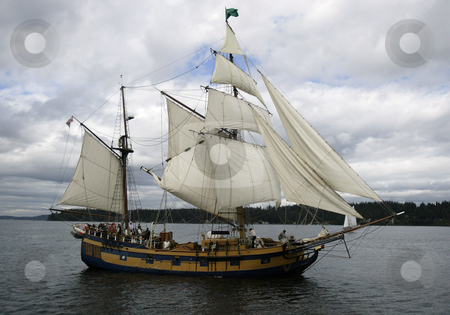 To use this stock image in your creative project, please select the size you need over to the right and click the "Add to Cart" button.
Your downloaded image will come with the Cutcaster watermark removed so don’t worry about the watermark you see on this page. The Hawaiian Chieftain stock photo, 27, August 2008: The Hawaiian Chieftain a tall ship battled the Lady Washington Wednesday during a canon battle sail in front of the Port of Brownsville in Brownsville, Washington. For $50.00 you could ride on one of the two tall ships during the canon battle between the two boats. by Jesse Beals
