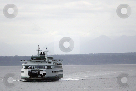 To use this stock image in your creative project, please select the size you need over to the right and click the "Add to Cart" button.
Your downloaded image will come with the Cutcaster watermark removed so don’t worry about the watermark you see on this page. Wenatchee Washington State Ferry stock photo, July 22, 2008: The Wenatchee Washington State Ferry heading from Bainbridge Island makes it's way towards the Seattle terminal in Seattle, Washington. by Jesse Beals