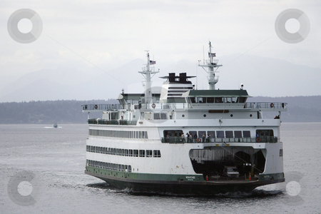 To use this stock image in your creative project, please select the size you need over to the right and click the "Add to Cart" button.
Your downloaded image will come with the Cutcaster watermark removed so don’t worry about the watermark you see on this page. Wenatchee Washington State Ferry stock photo, July 22, 2008: The Wenatchee Washington State Ferry heading from Bainbridge Island makes it's way towards the Seattle terminal in Seattle, Washington. by Jesse Beals