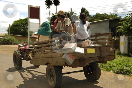 To use this stock image in your creative project, please select the size you need over to the right and click the "Add to Cart" button.
Your downloaded image will come with the Cutcaster watermark removed so don’t worry about the watermark you see on this page. Poor people on a car stock photo, People sitting on a car traveling with rice and food by Ichi Photo