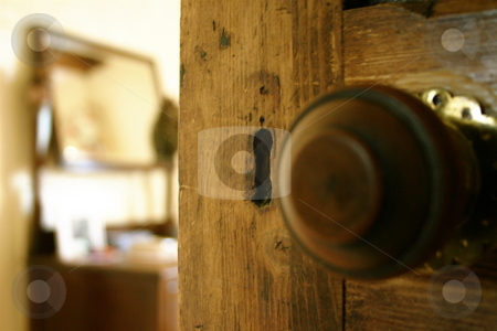 To use this stock image in your creative project, please select the size you need over to the right and click the "Add to Cart" button.
Your downloaded image will come with the Cutcaster watermark removed so don’t worry about the watermark you see on this page. Behind the Door stock photo, A partially open door leading into a bedroom by Jeff Crowe
