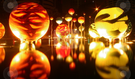 To use this stock image in your creative project, please select the size you need over to the right and click the "Add to Cart" button.
Your downloaded image will come with the Cutcaster watermark removed so don’t worry about the watermark you see on this page. Reflections stock photo, Reflective balls hover over a pond in Singapore by Jeff Crowe