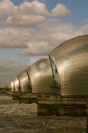 To use this stock image in your creative project, please select the size you need over to the right and click the "Add to Cart" button.
Your downloaded image will come with the Cutcaster watermark removed so don’t worry about the watermark you see on this page. Thames Barrier in Summer stock photo, The Thames Barrier in London, England by Jeff Crowe