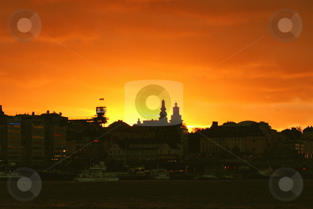 To use this stock image in your creative project, please select the size you need over to the right and click the "Add to Cart" button.
Your downloaded image will come with the Cutcaster watermark removed so don’t worry about the watermark you see on this page. Sunset over Stockholm stock photo, Early winter sunset in Stockholm by Jeff Crowe