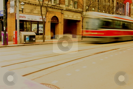 To use this stock image in your creative project, please select the size you need over to the right and click the "Add to Cart" button.
Your downloaded image will come with the Cutcaster watermark removed so don’t worry about the watermark you see on this page. Downtown Streetcar stock photo, A Toronto streetcar driving along King Street by Jeff Crowe