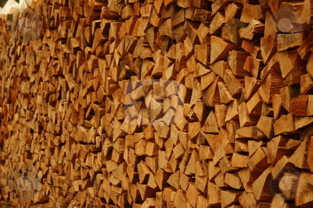 To use this stock image in your creative project, please select the size you need over to the right and click the "Add to Cart" button.
Your downloaded image will come with the Cutcaster watermark removed so don’t worry about the watermark you see on this page. Giant wood pile stock photo, A pile of wood by Jeff Crowe
