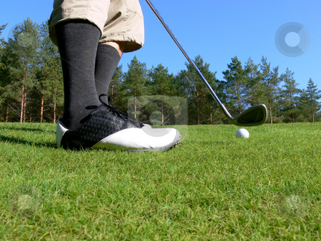 To use this stock image in your creative project, please select the size you need over to the right and click the "Add to Cart" button.
Your downloaded image will come with the Cutcaster watermark removed so don’t worry about the watermark you see on this page. Golf - Pitching a Ball stock photo, Close-up of a golfer pitching a golf ball towards the green by Niklas Ramberg